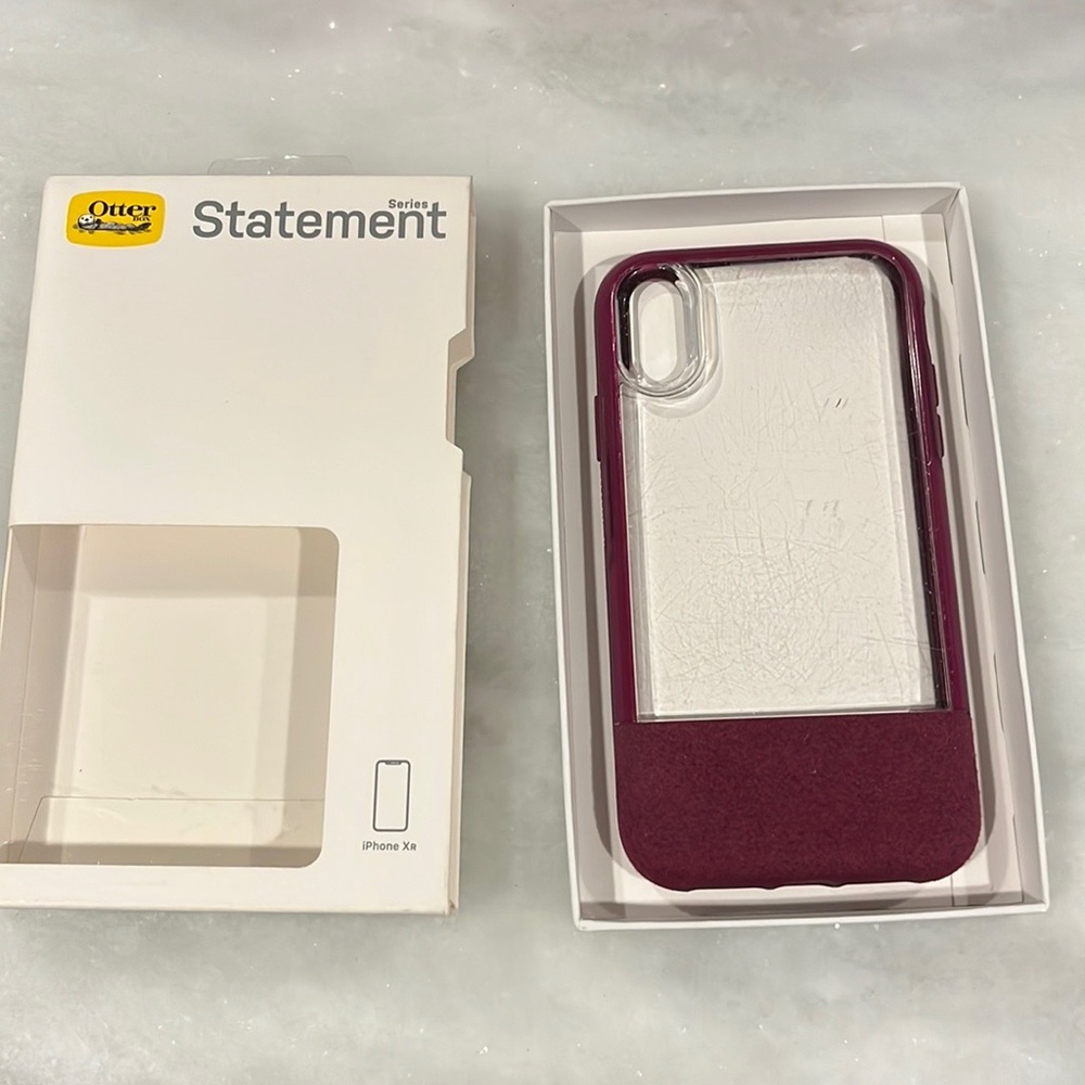 Otter box for IPhone XR.  Clear plastic on the front in dark purple case